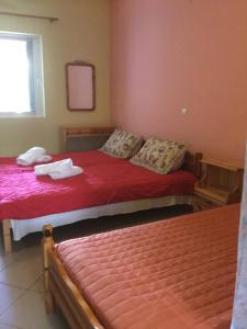 Postel nebo postele na pokoji v ubytování Hotel Kallithea