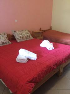 Postel nebo postele na pokoji v ubytování Hotel Kallithea