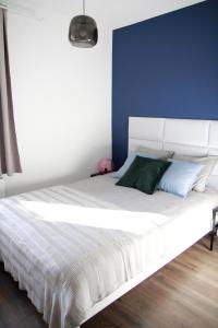 Posteľ alebo postele v izbe v ubytovaní Apartament Flauta
