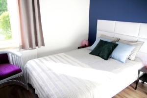 Łóżko lub łóżka w pokoju w obiekcie Apartament Flauta