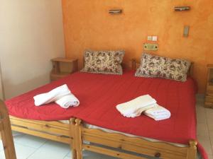 Postel nebo postele na pokoji v ubytování Hotel Kallithea
