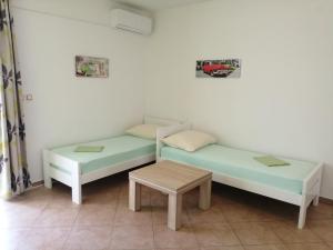 Postel nebo postele na pokoji v ubytování Apartments Jurjevic