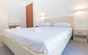 Postel nebo postele na pokoji v ubytování Apartments Latkovic