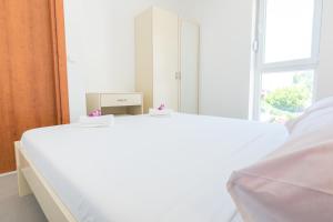 Postel nebo postele na pokoji v ubytování Apartments Latkovic