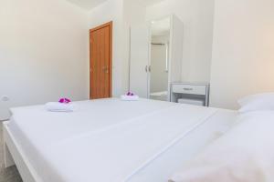 Postel nebo postele na pokoji v ubytování Apartments Latkovic