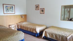 Postel nebo postele na pokoji v ubytování Revontuli Resort Rooms