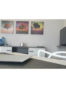 A television and/or entertainment centre at Island Apartment Porto Cesareo