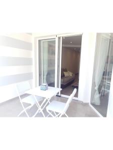 A balcony or terrace at Island Apartment Porto Cesareo
