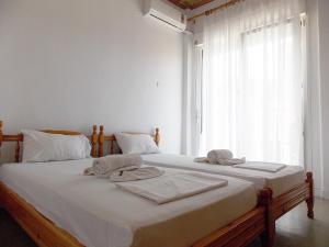 Postel nebo postele na pokoji v ubytování Hotel Sgouridis