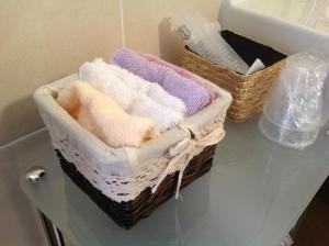 two baskets of towels on a counter in a bathroom at Agriturismo Ca' La Pergola in Verona +66 photos