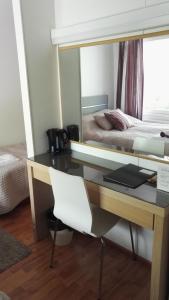 Postel nebo postele na pokoji v ubytování Revontuli Resort Rooms