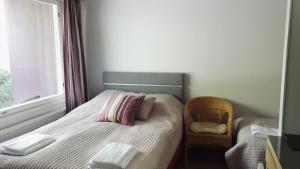 Postel nebo postele na pokoji v ubytování Revontuli Resort Rooms