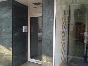 a door to a building with a glass door at City Apartments Will in Emmerich