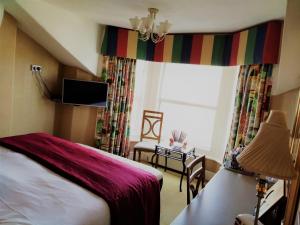 A television and/or entertainment center at Bay Tree House Southport 