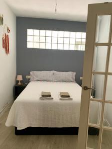 Säng eller sängar i ett rum på O Cruceiro