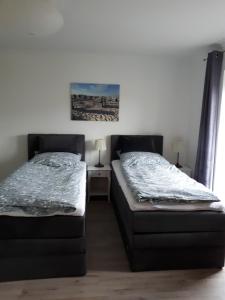 Postel nebo postele na pokoji v ubytování Sportpension "Seminarhaus an der Eider"