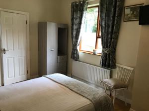 A bed or beds in a room at Steeple View B&B Guesthouse Donegal - Newly renovated in 2023