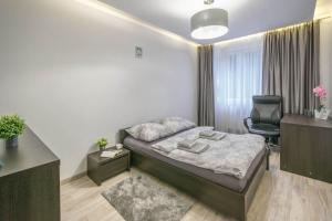 Ένα ή περισσότερα κρεβάτια σε δωμάτιο στο New Apartment
