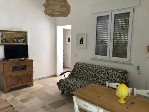 TV a/nebo společenská místnost v ubytování FICOMORO surf house