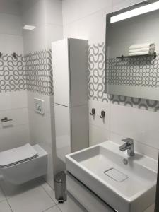 Et badeværelse på Apartamenty nad morzem & SPA BEST HOME 5 Mórz