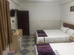 A bed or beds in a room at Don Bosco Guesthouse