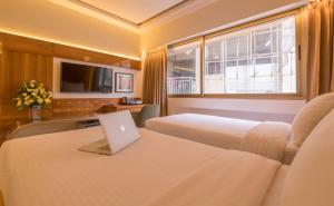 TV a/nebo společenská místnost v ubytování Hotel Metropole Inn