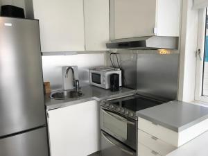 A cozinha ou cozinha compacta de Bergen City Apartments Halvkannesmauet
