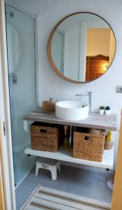a bathroom with a sink and a mirror at Apartamento Casa Palabra in Santander +28 photos
