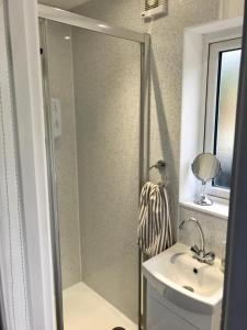 a bathroom with a shower and a sink at Morven in Dufftown
