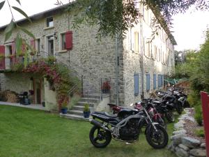 a group of motorcycles parked in front of a building at Montagne attitude in Jausiers