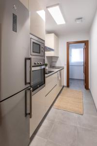 Kuchyň nebo kuchyňský kout v ubytování Apartamento La Nuit con Parking gratis en centro histórico