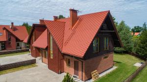 an overhead view of a house with an orange roof at Naujoji Karkle in Karklė