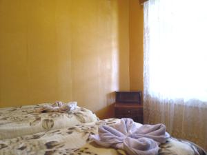 Postel nebo postele na pokoji v ubytování Guest House Tengo