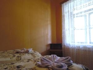 Postel nebo postele na pokoji v ubytování Guest House Tengo