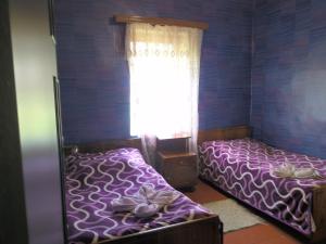 Llit o llits en una habitació de Guest House Tengo