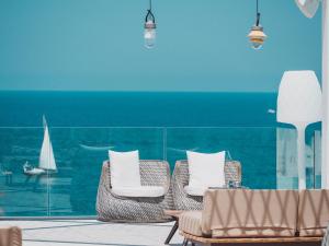 A seating area at Amàre Beach Hotel Ibiza - Adults Recommended