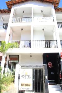 a white building with a hostel on it at Hostel da Moda in Passos