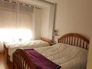 Postel nebo postele na pokoji v ubytování Apartamentos Grifovacances Consuegra 1