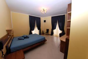 Postel nebo postele na pokoji v ubytování Hotel Miramare