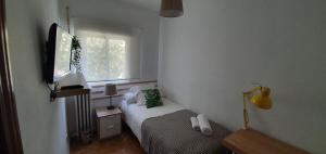 Łóżko lub łóżka w pokoju w obiekcie Real Beds Madrid