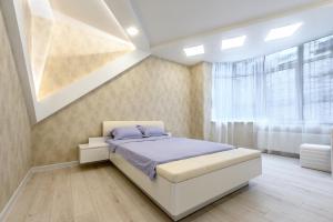 Ένα ή περισσότερα κρεβάτια σε δωμάτιο στο Апартаменты с террасой 80 м в Аркадии