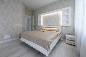 Ένα ή περισσότερα κρεβάτια σε δωμάτιο στο Апартаменты с террасой 80 м в Аркадии