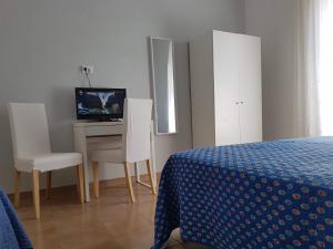 Posteľ alebo postele v izbe v ubytovaní L'arancio B&B