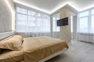 Ένα ή περισσότερα κρεβάτια σε δωμάτιο στο Апартаменты с террасой 80 м в Аркадии +24 φωτογραφίες