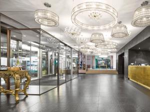 a lobby of a store with chandeliers at MAXX by Steigenberger Vienna in Vienna