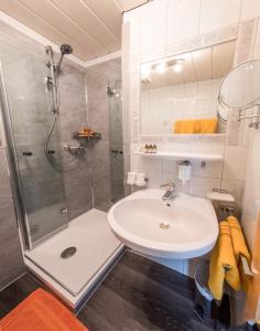 a bathroom with a shower and a sink at Appartements Kuprian in Längenfeld +28 photos