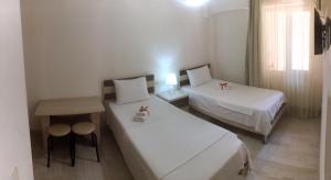 Postel nebo postele na pokoji v ubytování Hotel Tao