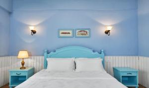 Postel nebo postele na pokoji v ubytování Memory Inn Guilin Central