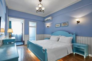 Postel nebo postele na pokoji v ubytování Memory Inn Guilin Central