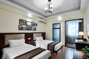 Postel nebo postele na pokoji v ubytování Memory Inn Guilin Central